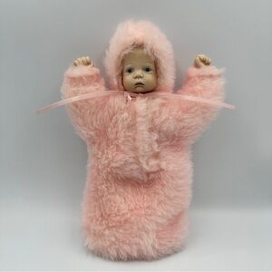 Handcrafted Porcelain Baby in soft fuzzy one piece pink bunting bag.